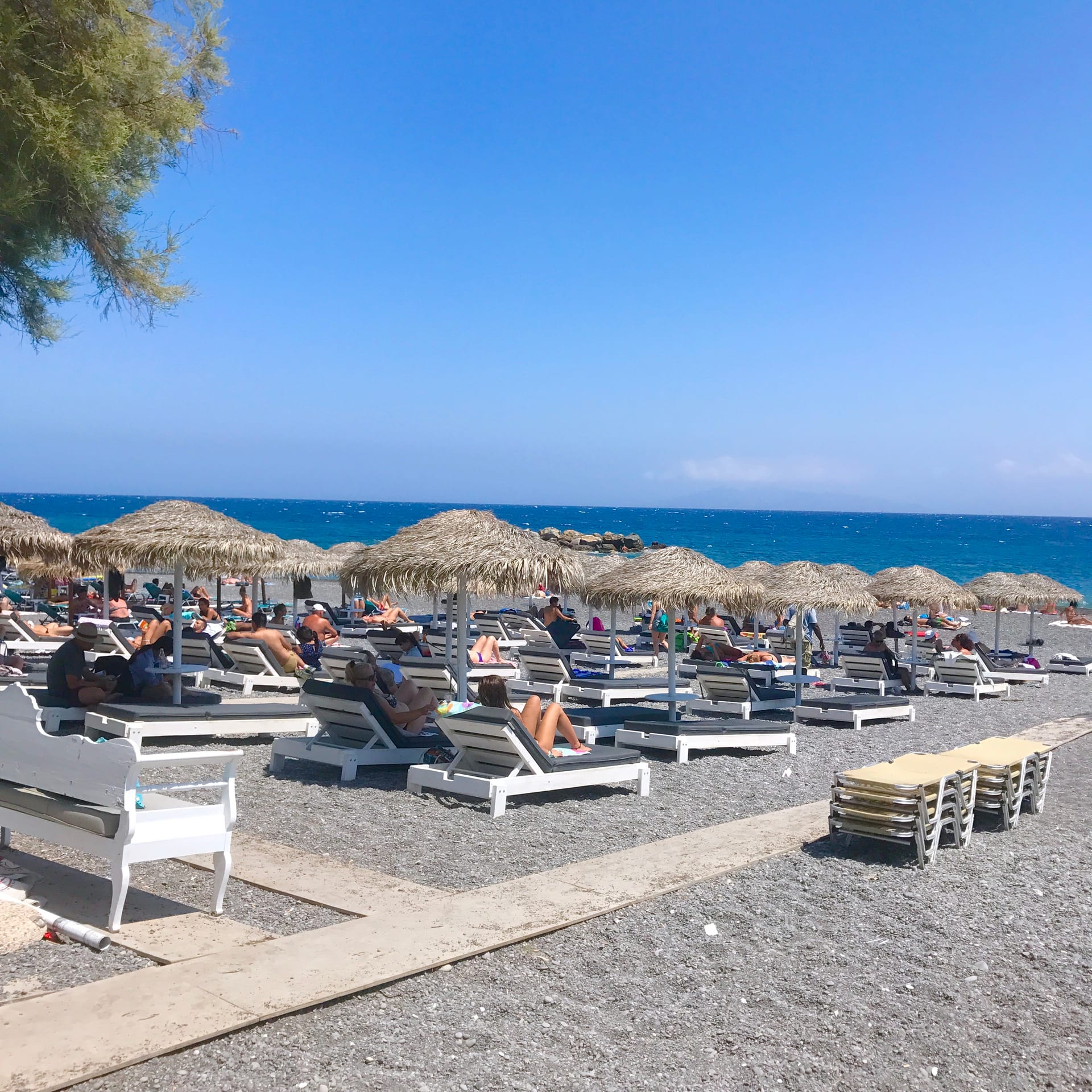 Perissa or Kamari black-sand beach on Santorini