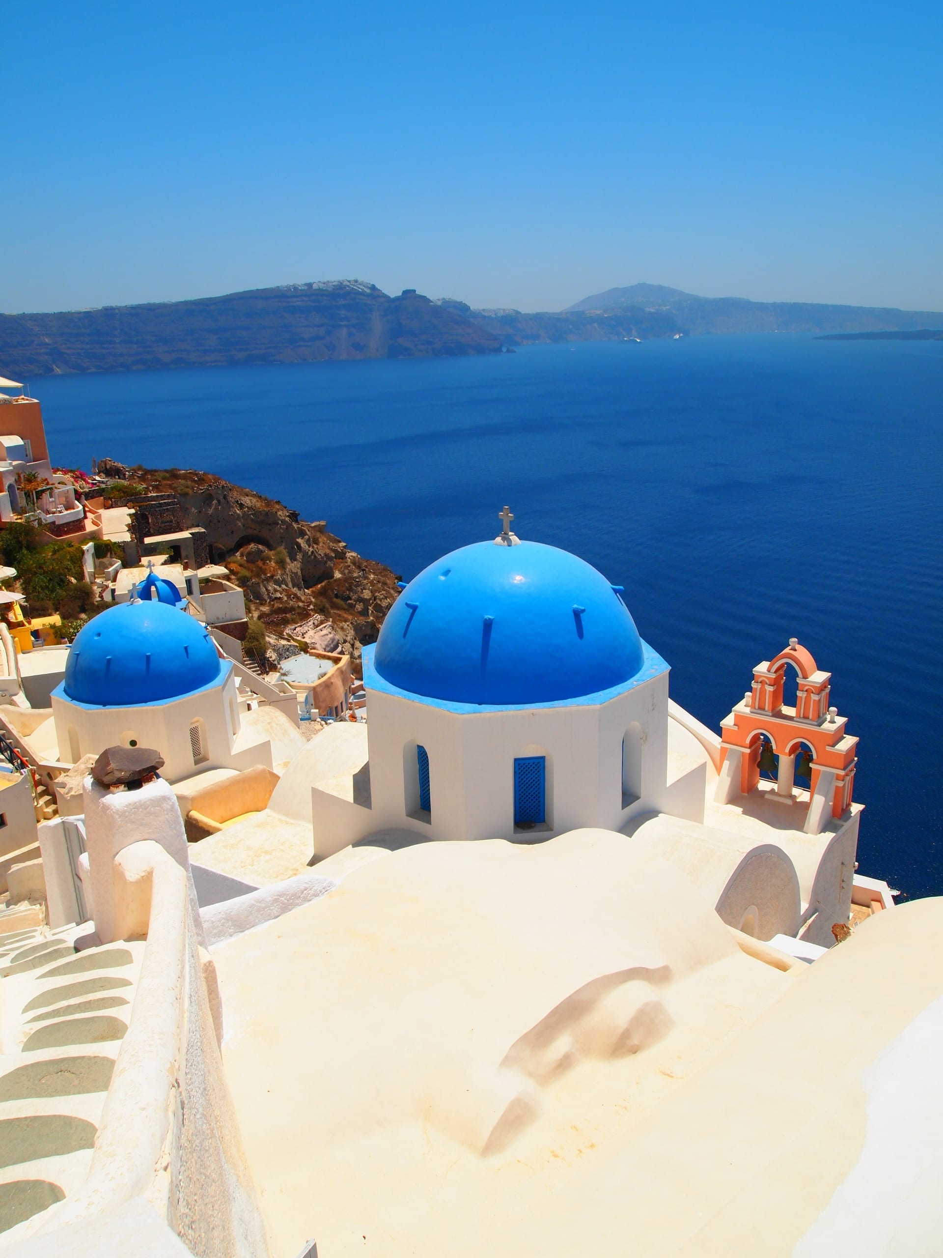 Oia blue domes and the Santorini caldera — the view that anchors a cruise day